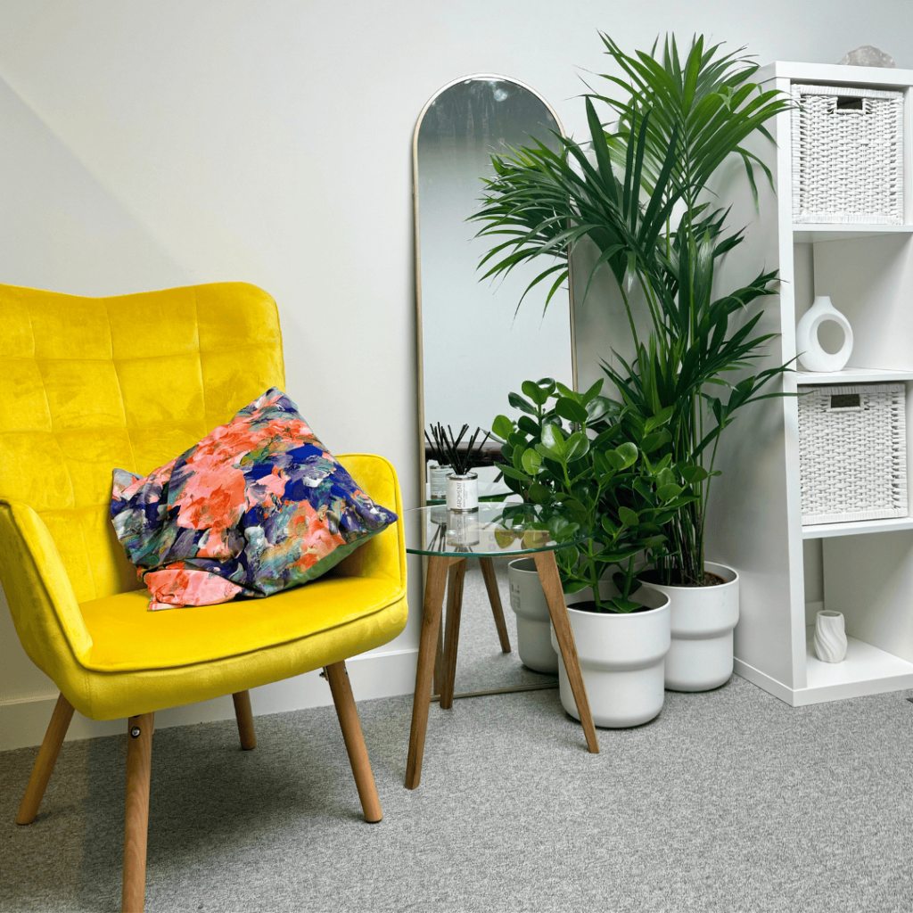Yellow beautiful chair in stunning clinic room of a Top Rated London Chiropractor Westminster