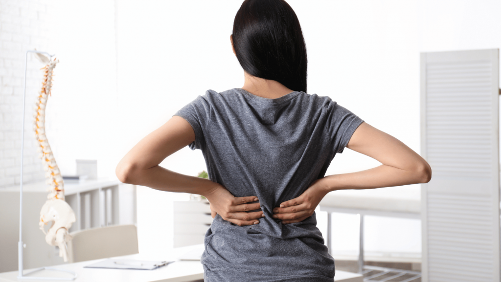 Back pain when sitting at a desk, common among professionals working in Battersea London