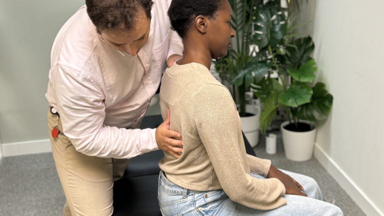 Battersea chiropractor helping a patient at Battersea and Chelsea Chiropractic with Back Pain When Sitting