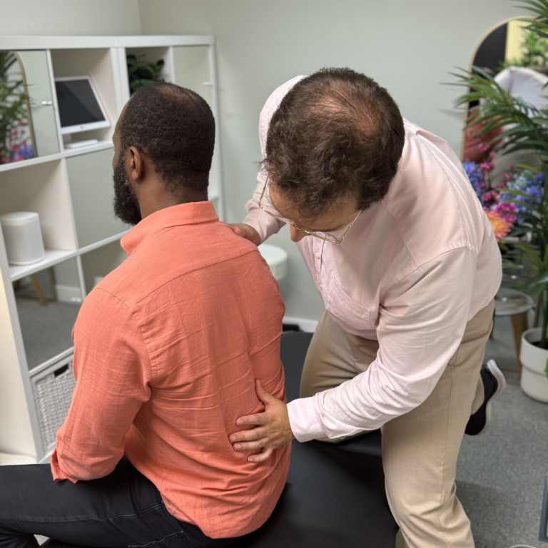 What it means when your back hurts while sitting, explained by a chiropractor in Battersea, London