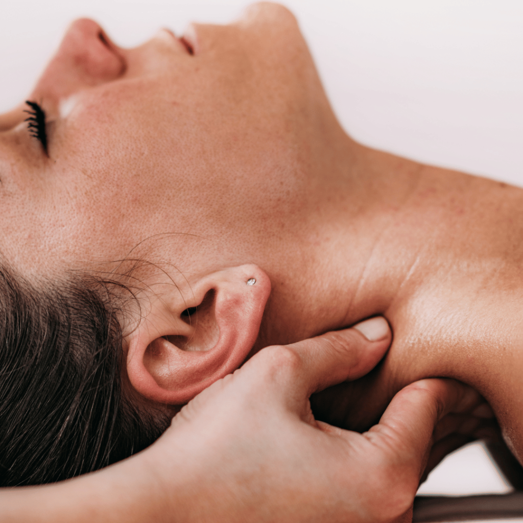 Woman having top neck sports massage at Battersea Chelsea Chiropractic & Physiotherapy Clinic